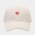 Close-up of a beige corduroy baseball cap featuring detailed red heart embroidery - Adjustable / White