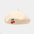 Detailed close-up of red cherry embroidery on a cream wool blend beret hat for women - One Size / Beige
