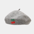 Detail of grey wool beret featuring a delicate red cherry embroidery on a white background - One Size / Gray