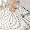 White modular TPE anti-slip bath mat with drainage holes shown in a bathroom setting - Vitality Nordic - Off White