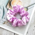 Elegant mauve satin scrunchie with a glossy silk texture and pleated design - Pink Purple