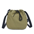 Olive green nylon drawstring bucket bag with adjustable black shoulder strap and texture - Green