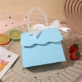 Light blue paper gift box with pearl handle and white satin bow for wedding favors - Light Blue