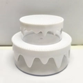 Detail view of double-layer cream cake storage box with white dripping effect and beads - White