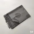 Detailed view of gray faux cashmere scarf featuring tree patterns and soft fringe tassels - Tree Pattern #9