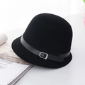 Classic black wool felt equestrian hat with leather band and metal buckle on desk - Black