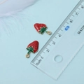 Detail of red strawberry pendant with scale ruler showing 15mm size on blue background - Big Strawberry