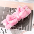 Pink coral fleece headband with white polka dots and a large bow for skincare - Pink Polka Dots