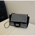 Close-up of sparkling silver rhinestones on black suede crossbody bag with chain - Silver