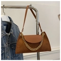 Detail of brown corduroy shoulder bag featuring a bold gold chain and leather trim - Brown