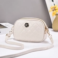 Elegant off-white quilted crossbody bag featuring a camellia flower and gold zipper - White