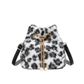 Stylish black and white leopard print plush bucket bag with golden chain and pearl charms - Off White