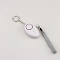 Detail view of the white personal safety alarm with keychain and grey braided lanyard - White