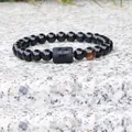 Elastic beaded bracelet with 8mm black beads, tiger eye stone and Gemini zodiac charm - Gemini