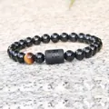 8mm Virgo elastic bracelet with black polished beads and a single yellow tiger eye stone - Virgo