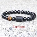 8mm Capricorn zodiac stretch bracelet with black beads and a tiger eye stone - Capricorn