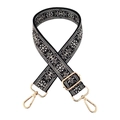 Detail of colorful jacquard wide bag strap with gold metal hooks and geometric embroidery - Grey and White on Black Base