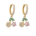 Macro detail of cherry charm hoop earrings with pink cubic zirconia and green leaf gems - Gold Colored Zircon Cherry Earrings