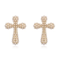 Close-up of golden cross earrings with white imitation pearls on a white background - Cross Style (Earrings) / Gold