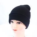 Close-up of black ribbed knit beanie with folded cuff shown on a female mannequin head - One Size / Black