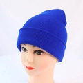Close-up of vibrant royal blue ribbed knit beanie with turn-up cuff on a display head - One Size / Blue