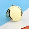 Detail of rose gold round metal pocket mirror with foldable structure on colorful background - Solid Bottom / Gold