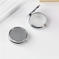 Portable silver round metal pill box with 3 compartments shown in open and closed views - 50mm Round Single-Grid