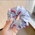 Light blue organza scrunchie with red strawberry print for elegant hair styling - Strawberry Blue