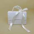 Detail of white gift box with floral embossing, pearl handle and large ribbon bow - Small / White