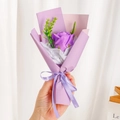Close-up of mini purple soap rose bouquet with Just for you ribbon and lavender paper - Purple