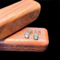 Detail of round silver stud earrings with zircon inlay on textured wood background - 5mm Stud Style (Single) / Steel