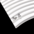 Macro view of silver bird-shaped titanium steel stud earrings on white wavy texture - Bird
