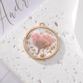 Round resin pendant featuring real pink dried daisy and gold leaf in copper frame - Gold Foil Pink Flower