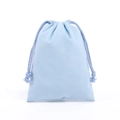 Light blue drawstring cotton pouch with soft texture and matching woven cords - Light Blue Cotton