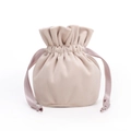 Detail view of a beige velvet drawstring pouch with soft texture and knotted cord ribbons - Diameter 10*13cm / Apricot