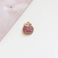 Close-up of a gold-plated apple pendant with red cubic zirconia and metal base - 1# Pink Zircon Apple