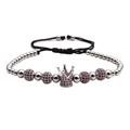 Detail of silver crown charm bracelet with dark red gemstone beads on adjustable cord - Platinum Rose Red Zircon Crown Bracelet