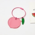 Detail of cute acrylic peach keychain with pink wire loop and hand-made engraving charm - Pink Peach