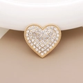 Dettaglio accessorio a forma di cuore dorato con strass e perle scintillanti - Stile Diamanti / Cuore in strass bianco base oro