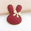 DIY charm for shoes featuring a wine red rabbit with lattice pattern and golden bow - Burgundy