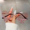 Detailed view of heart-shaped pink sunglasses with teardrop rhinestone fringe and metal frames - Pink Rhinestone Pink Lens