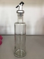 Slim glass oil bottle with silver leak-proof dispenser and black pourer component - Clear Glass Bottle