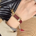 Elegant gold rectangular watch for women with deep wine red leather strap on model wrist - Gold/Wine Red (Rectangular YSL Logo Style)