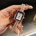 Detail of rose gold pearl strap watch with crystal bezel and white shell dial - Rose Gold