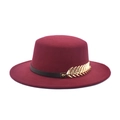 Close-up of wine red wool felt fedora featuring black leather band and gold metal leaf detail - M (56-58cm) / Burgundy