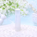 5g empty frosted clear plastic lip balm tube with a white cap on textured fabric - Clear