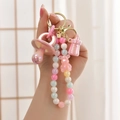 Süßer rosa Bären-Schlüsselanhänger mit bunten Perlen, Fläschchen und Schnuller in der Hand - Licht Gold Schnalle + Kette + Schnuller + Flasche / Rosa