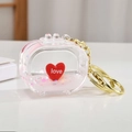 Llavero maleta de arenas movedizas rosas con motivo corazón love y aro dorado - Corazón-Televisión