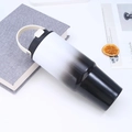Close-up of a 30oz black and white gradient stainless steel tumbler on a white desk - White Black Gradient