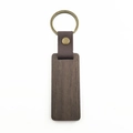 Detail of dark walnut wood keychain with brown leather strap and brass metal ring - Rectangular Walnut Wood